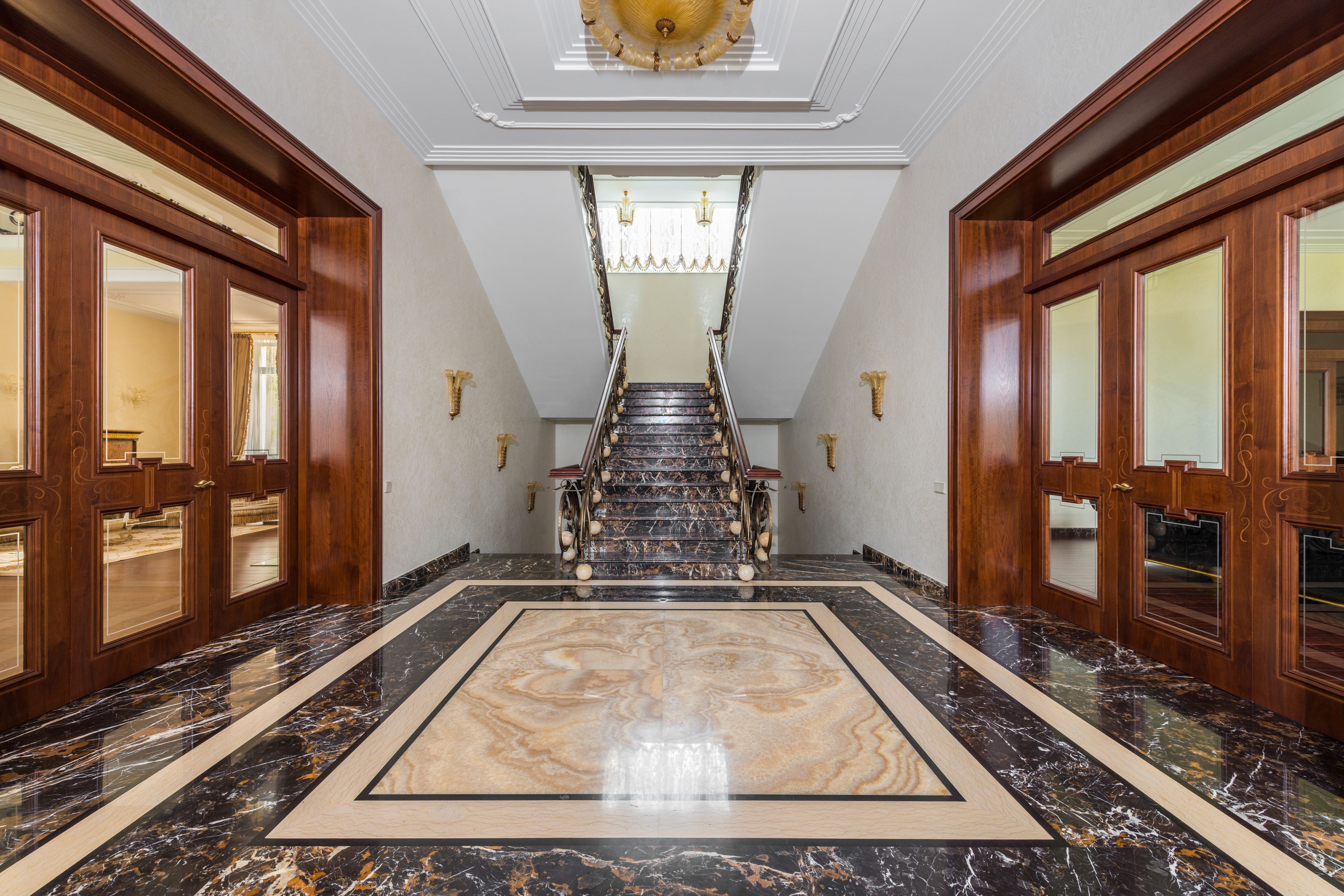 A luxury apartment corridor with a polished marble floor