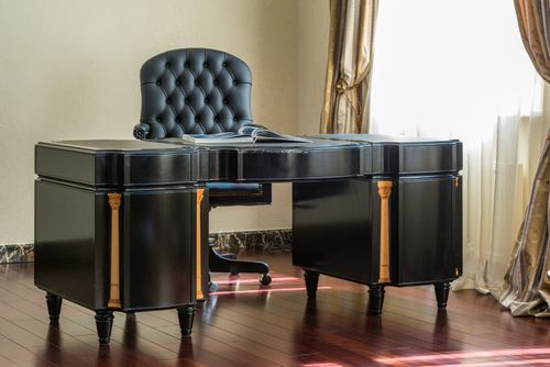 Free Black classic desk near elegant leather chair next to window with curtains in light study room Stock Photo