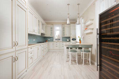 White wooden cabinets of expensive kitchen