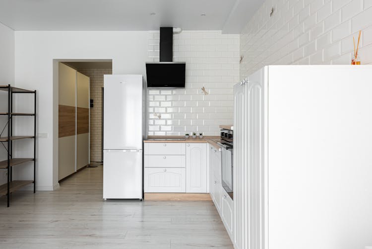 Modern Kitchen Interior With Fridge And Cabinets At Home