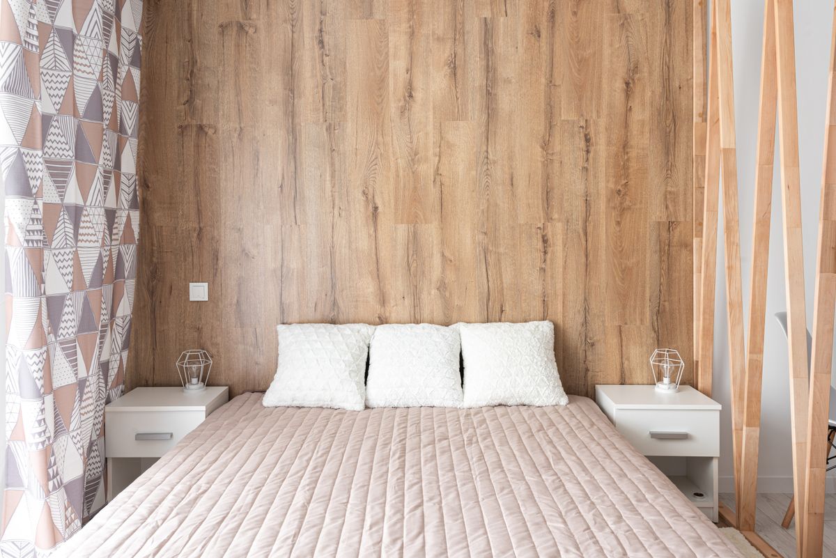 Bedroom with modern wooden feature wall paneling