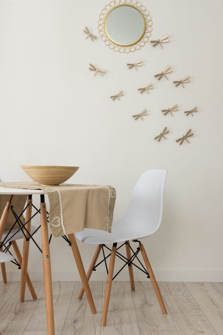 Modern Dining Room Interior With Bowl On Tablecloth At Home