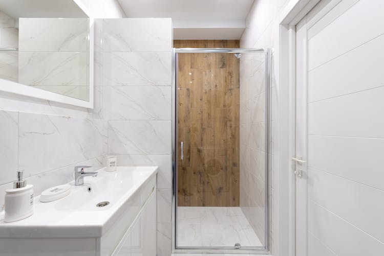 Contemporary Bathroom Interior With Washbasin And Glass Door