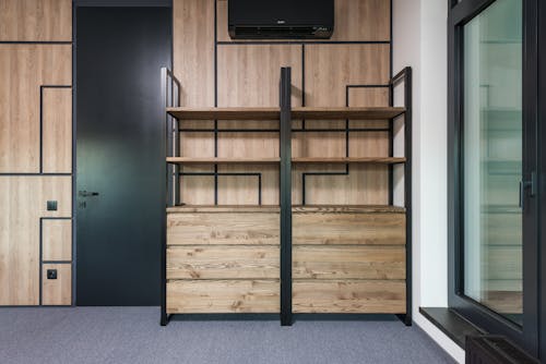 Empty room interior with shelves and door at home