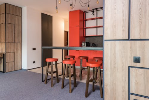 Modern kitchen interior with furniture and refrigerator in house