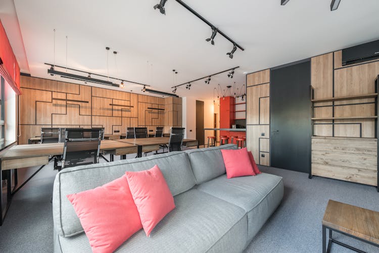 Modern Office Interior With Door And Furniture Under Lamps