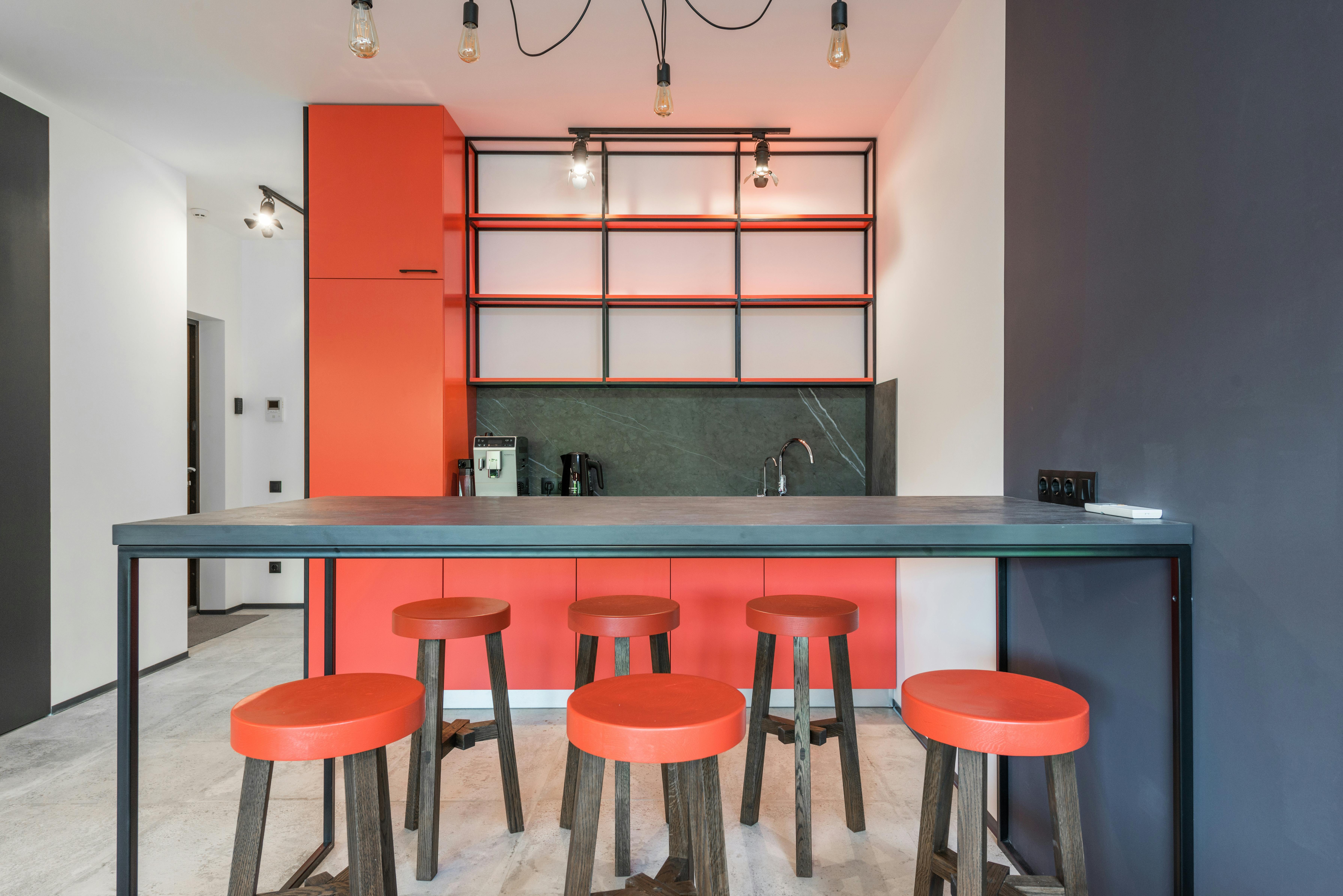 Download Stylish Kitchen Interior with Red Refrigerator Wallpaper