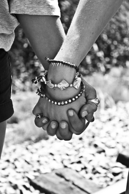 Greyscale Photography of Two Person Holding Hands
