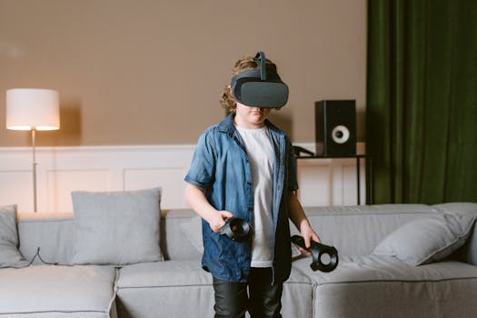 Young boy enjoying virtual reality gaming with VR headset and controllers indoors.