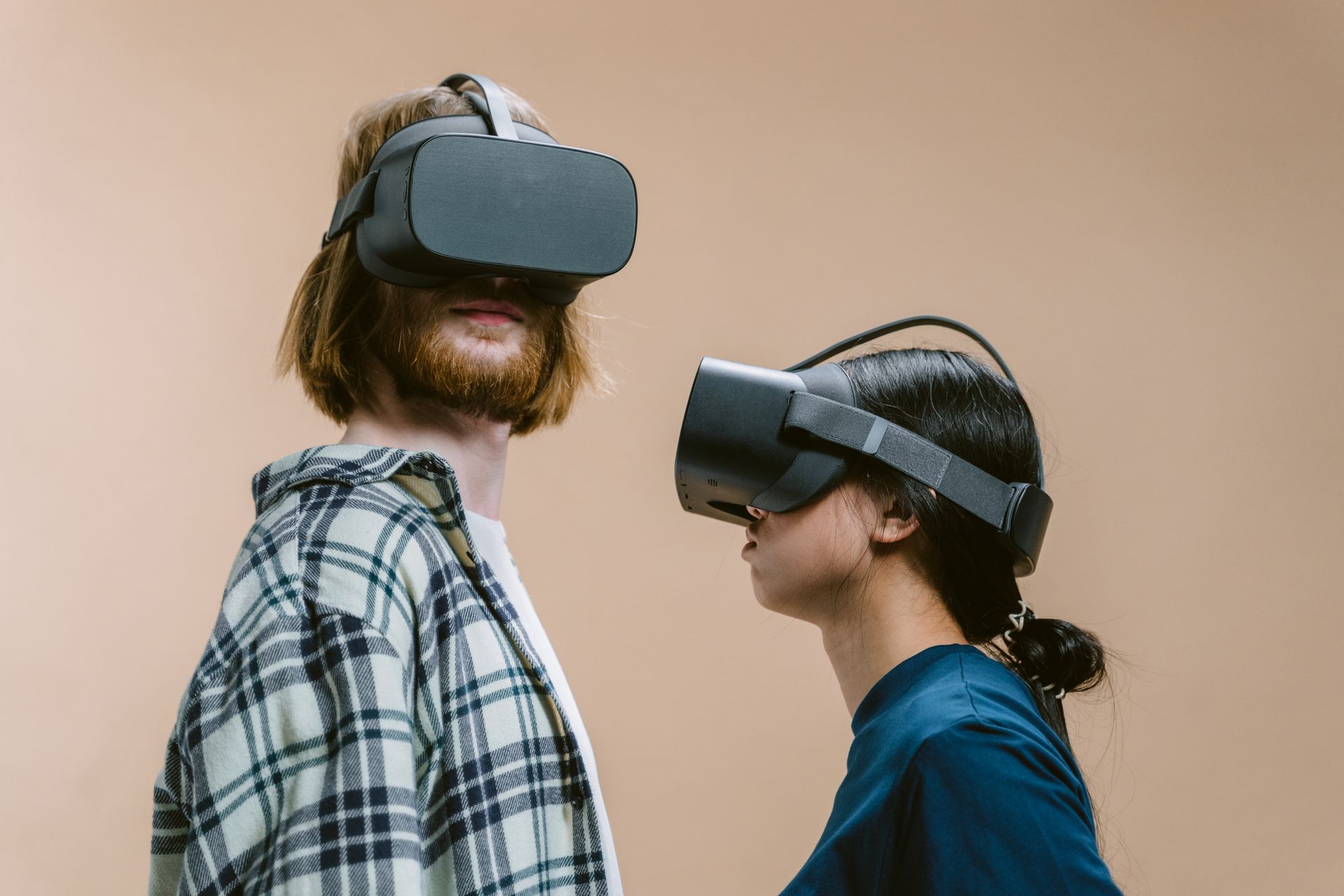 A Man and Woman Playing a Virtual Reality Video Game