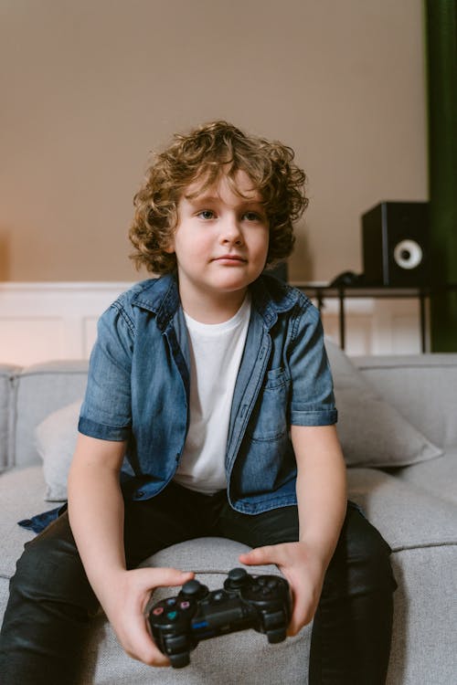 Kid Holding a Video Game Controller