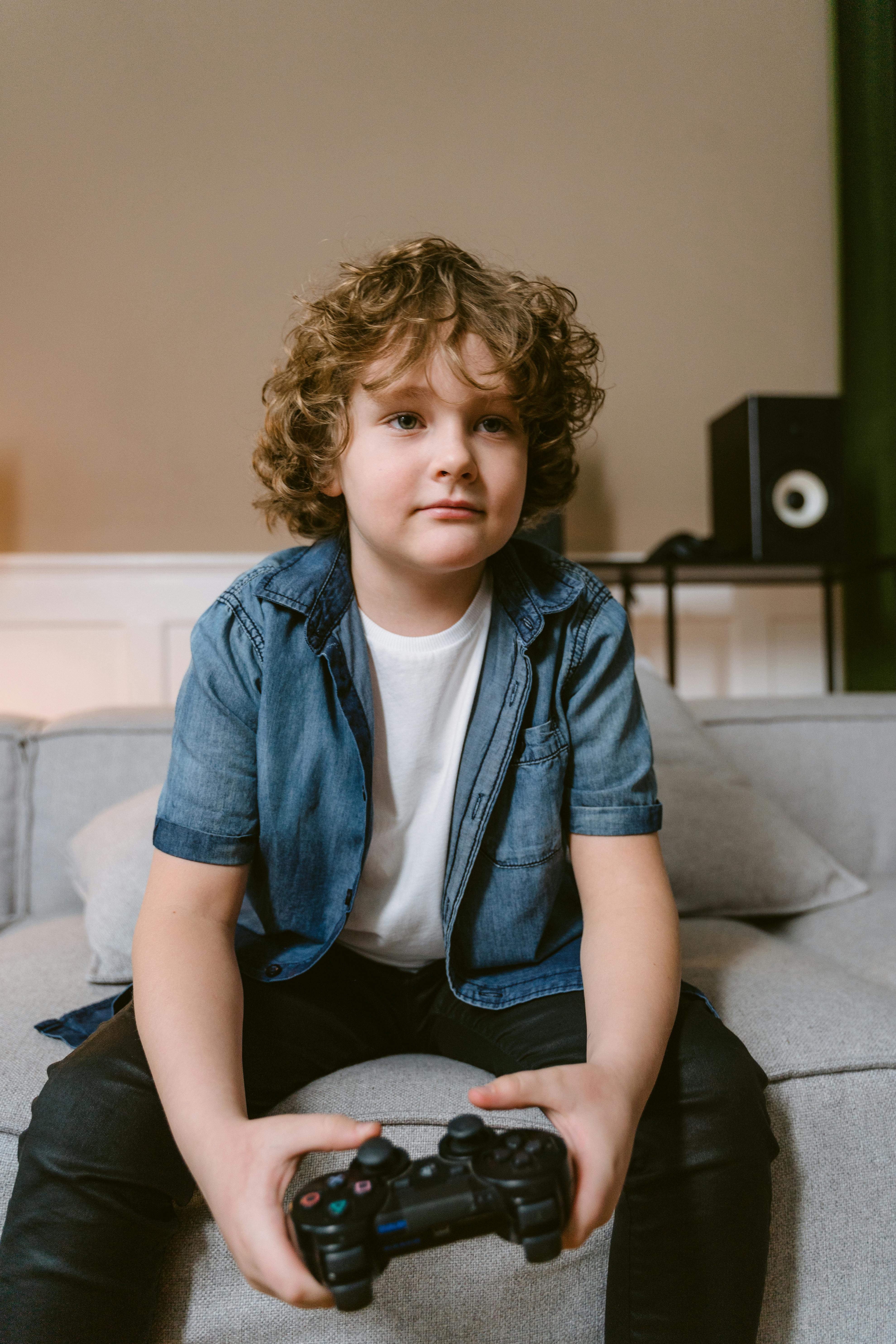 Smiling young child with video game controller Royalty-Free Stock Image -  Storyblocks