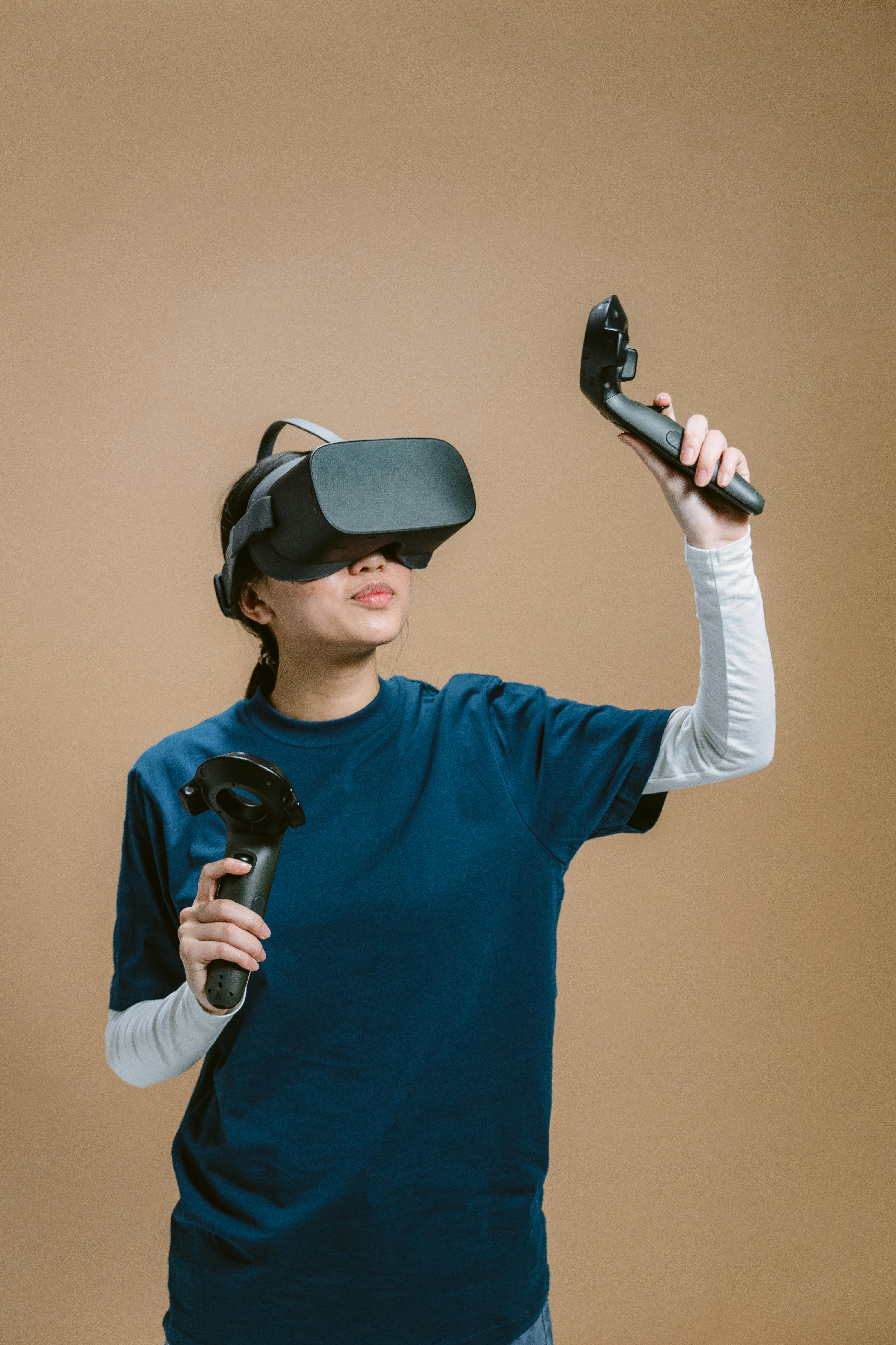 a person in blue shirt playing a virtual reality video game