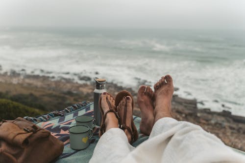 Two People Sitting on Picnic Blanket 