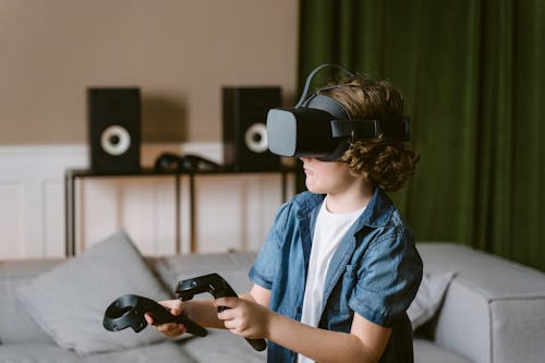 Shallow Focus Photo of a Boy Playing a Virtual Reality Video Game