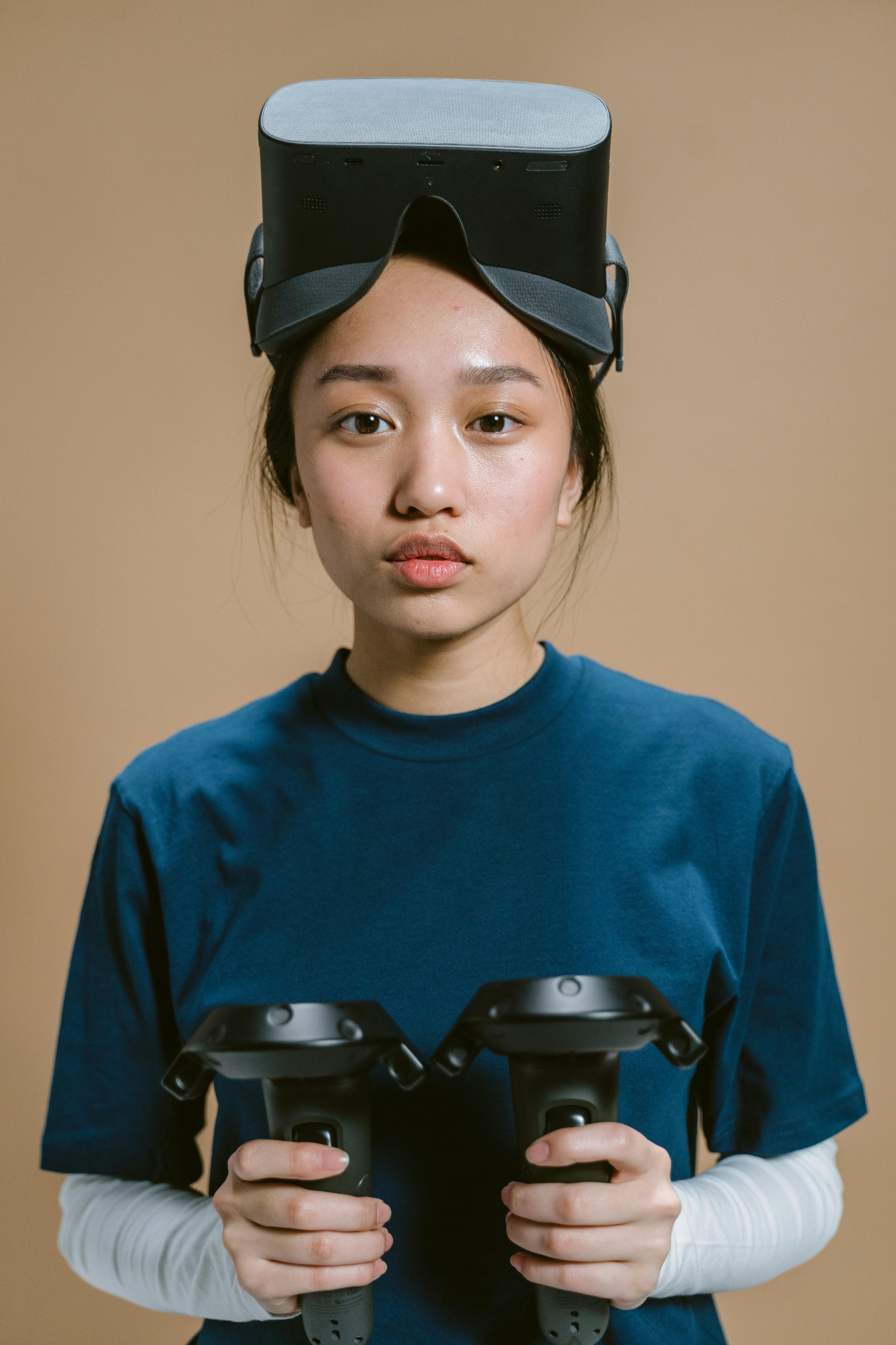 close up shot of a woman with virtual reality headset looking at camera