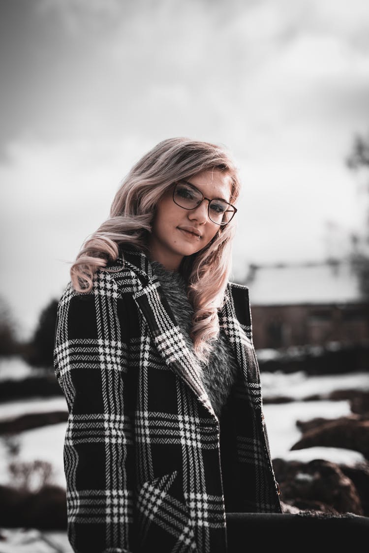 Portrait Of Blonde Woman In Oversized Coat