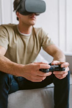 A young man wearing a VR headset and using a controller in a modern living room.