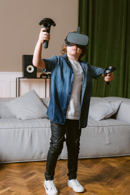 Free Shallow Focus Photo of a Boy Playing a Virtual Reality Video Game Stock Photo