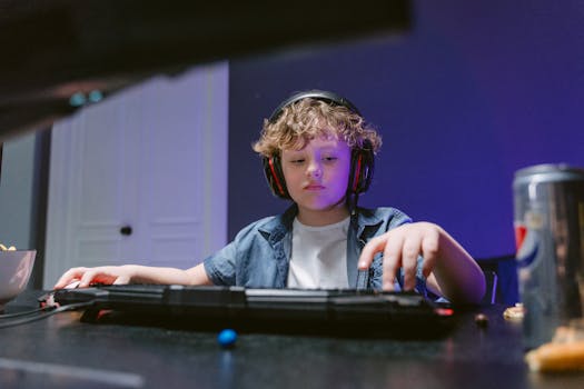 Young boy engrossed in gaming, wearing headphones, in a dimly lit room. E-sports vibe.