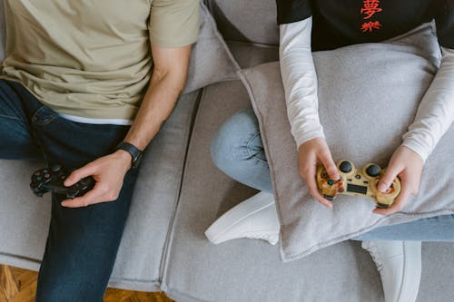 Close-Up Shot of Two People Playing a Video Game