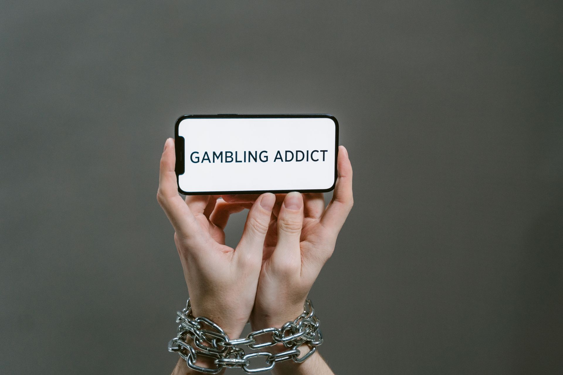 Person Holding White and Black Card
