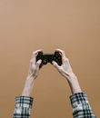 Person Holding Black Sony Ps 4 Game Controller