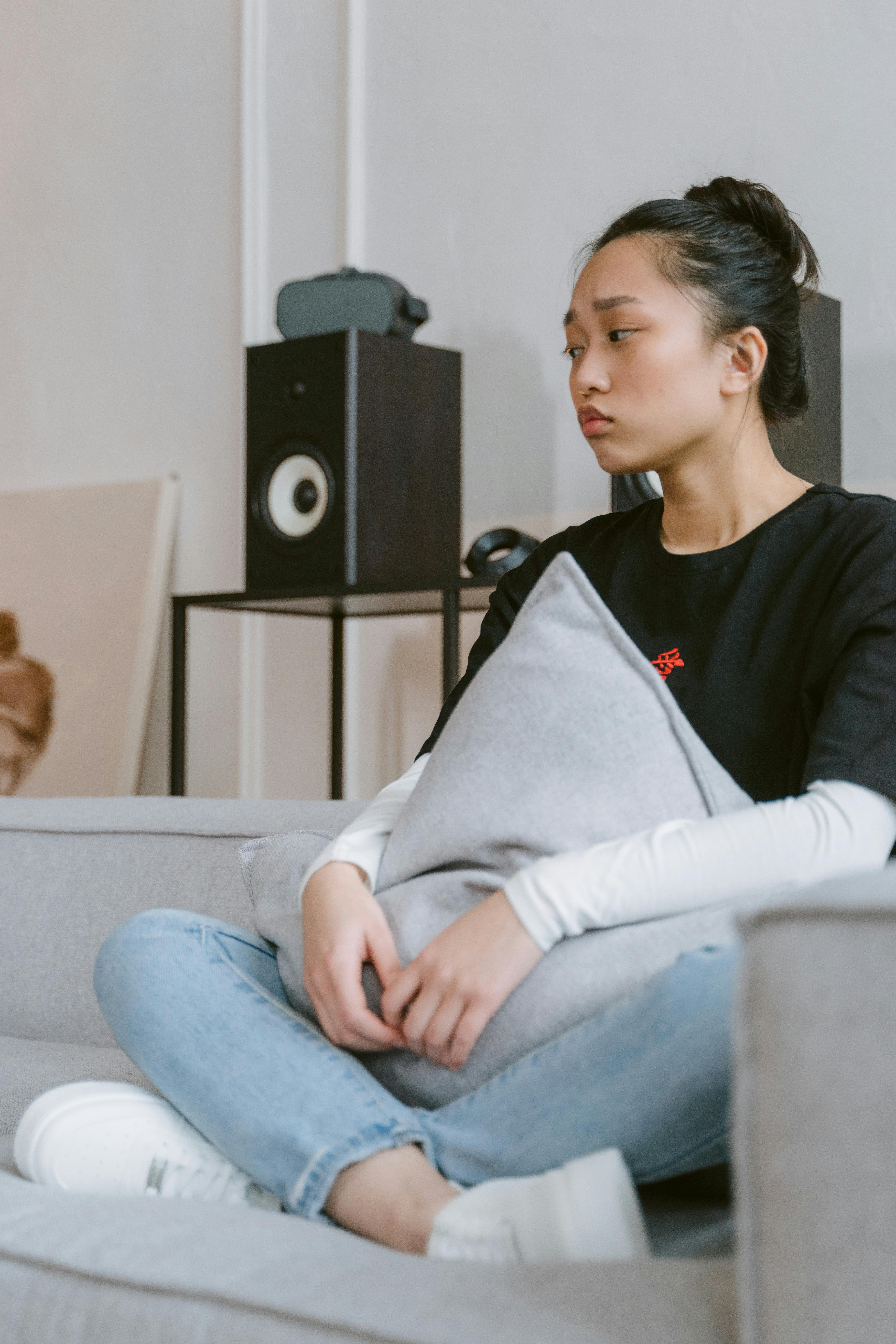 Person playing action RPG game with magical effects on screen