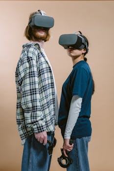 A young couple explores virtual reality with VR headsets and controllers against a neutral background.