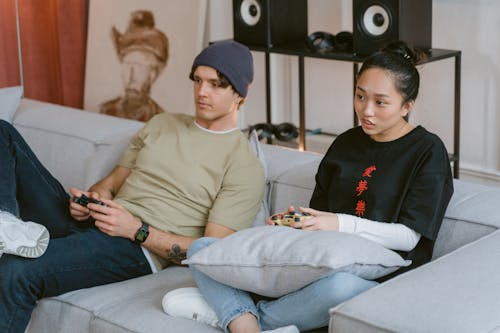A Ma and a Woman Playing Video Game