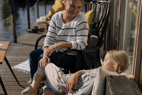 A Grandmother Watching Her Sleeping Granddaughter