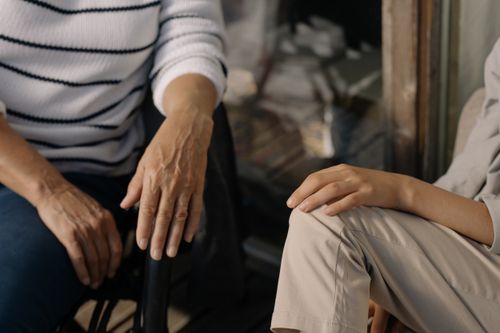 Free An intimate, close-up view of two people sharing a conversation indoors. Stock Photo