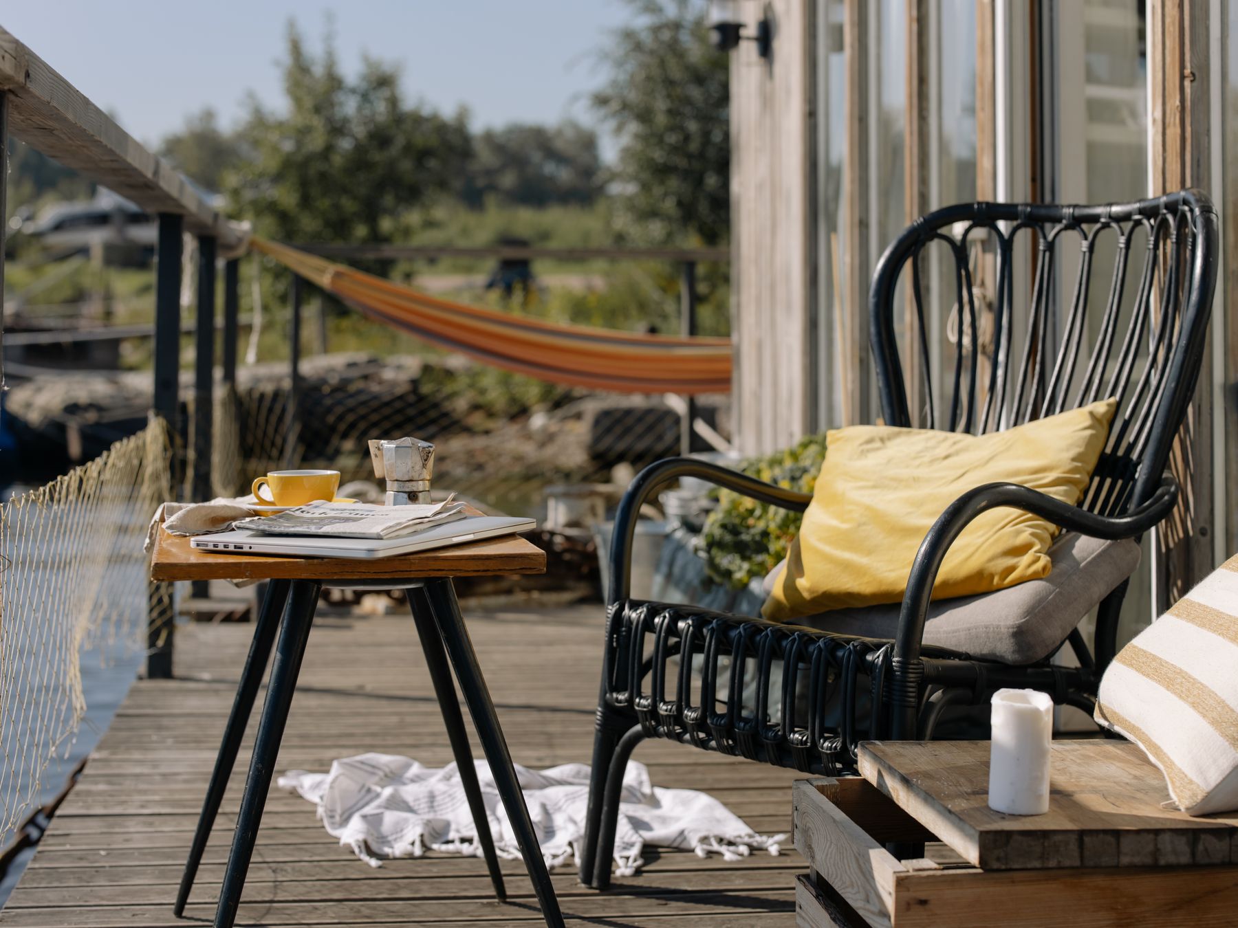 Fence and Decking Painting in The Burroughs — a decorator at work mid-project