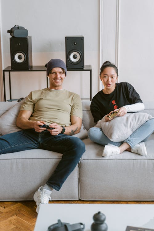 Free Man and Woman Playing a Video Game Stock Photo