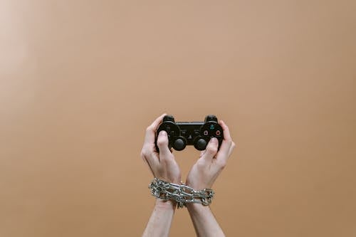 Close-Up Shot of a Person Holding a Game Controller