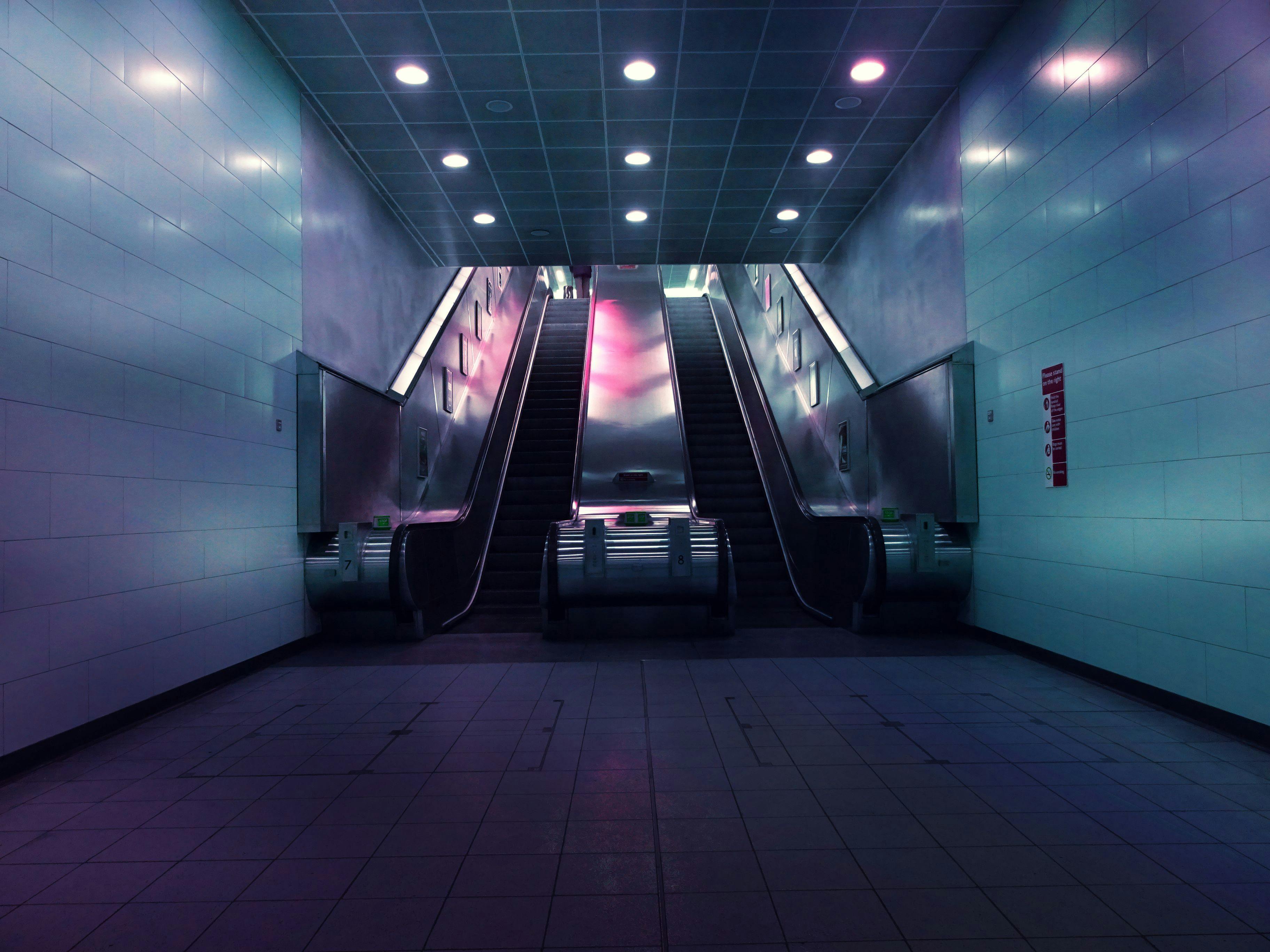 landscape photo of two escalators