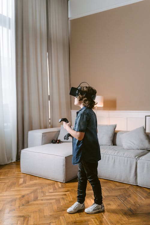 Free A Kid Playing with Virtual Reality Headset Stock Photo