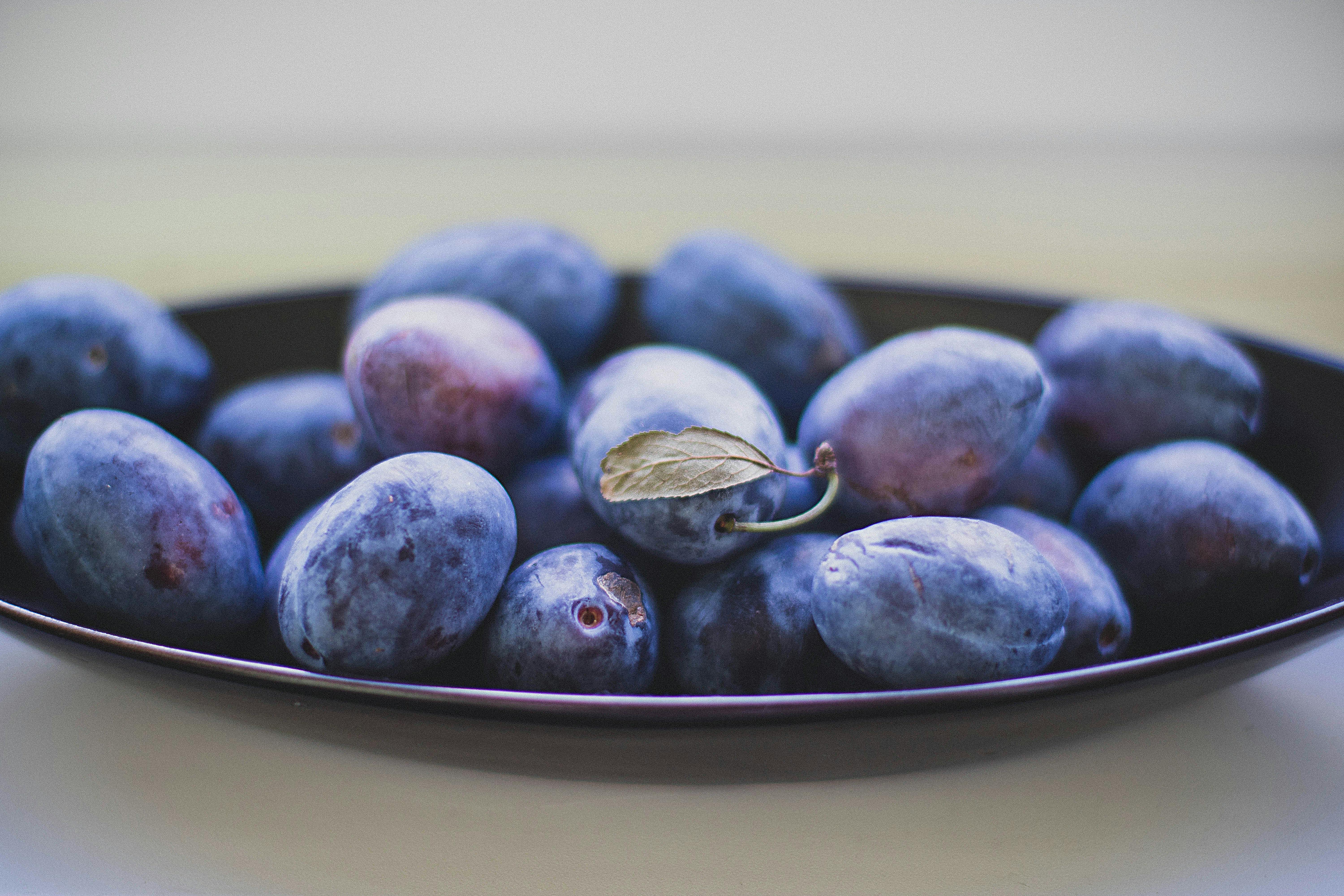 black berries on top of black ceramic plate