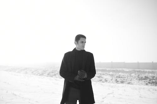 Man in Shirt and Black Long Sleeve Coat 