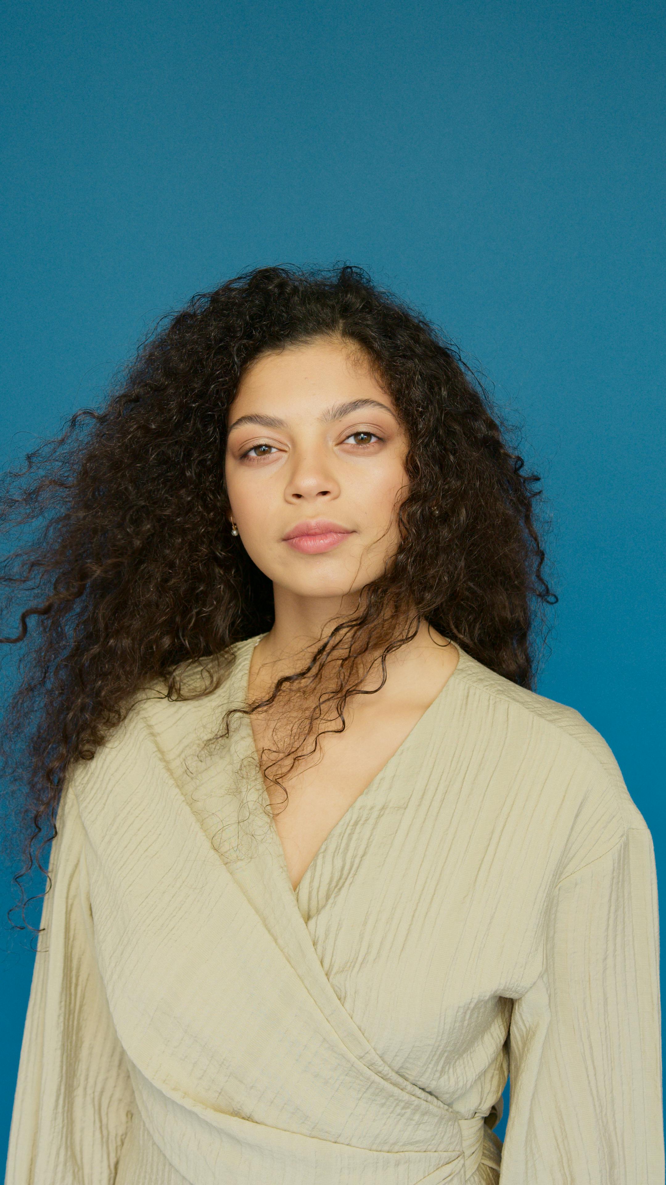 Woman in Beige Blazer With Red Lipstick
