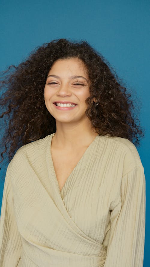 Woman in White V Neck Shirt Smiling