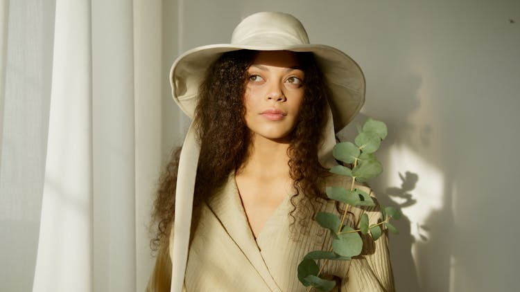 Woman In White Hat Near Green Plant