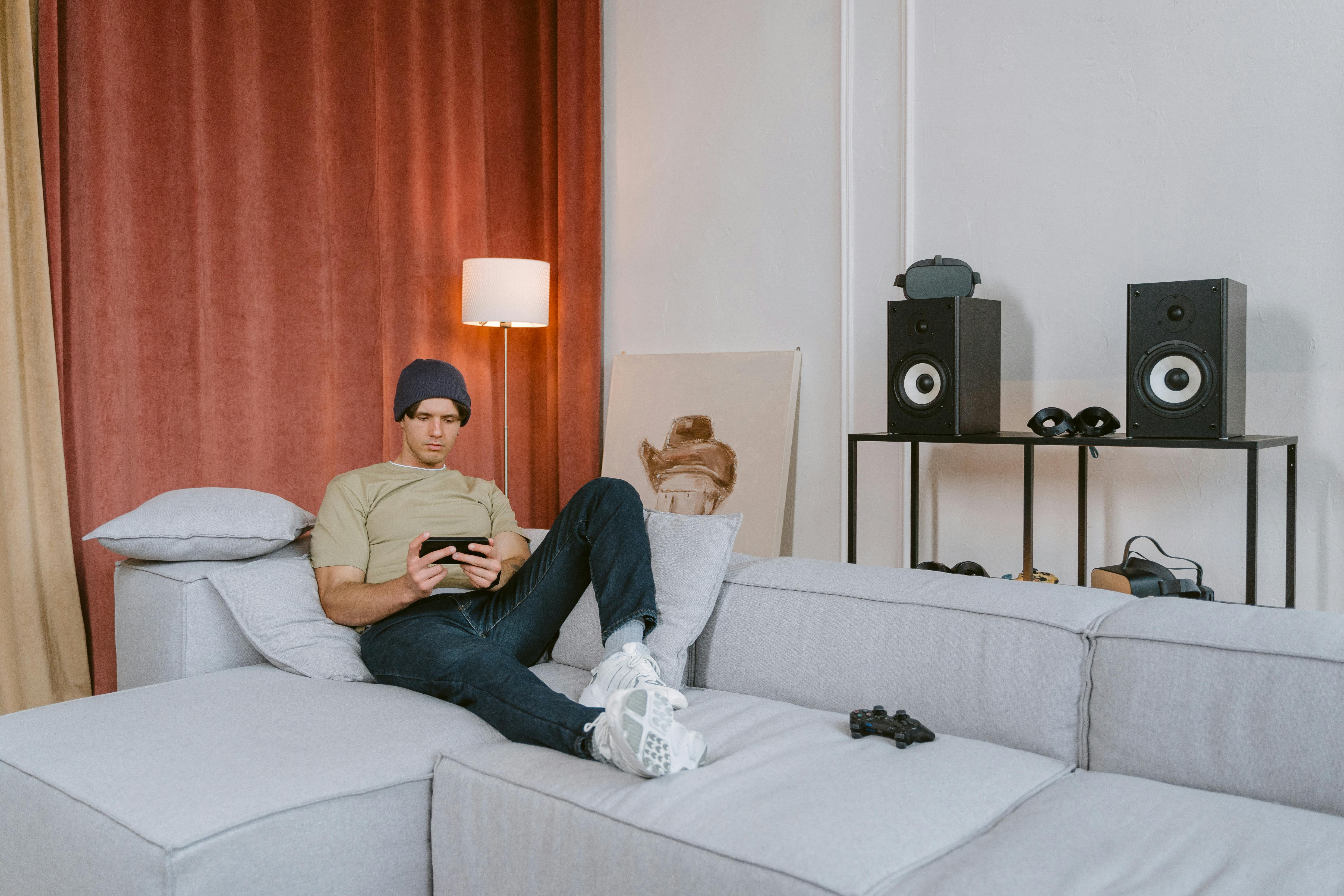 Person relaxing with gaming device