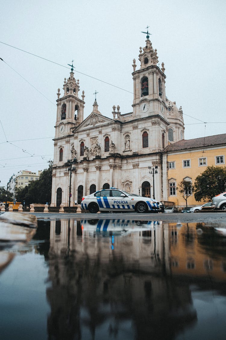 Police Car Near White Concrete Building