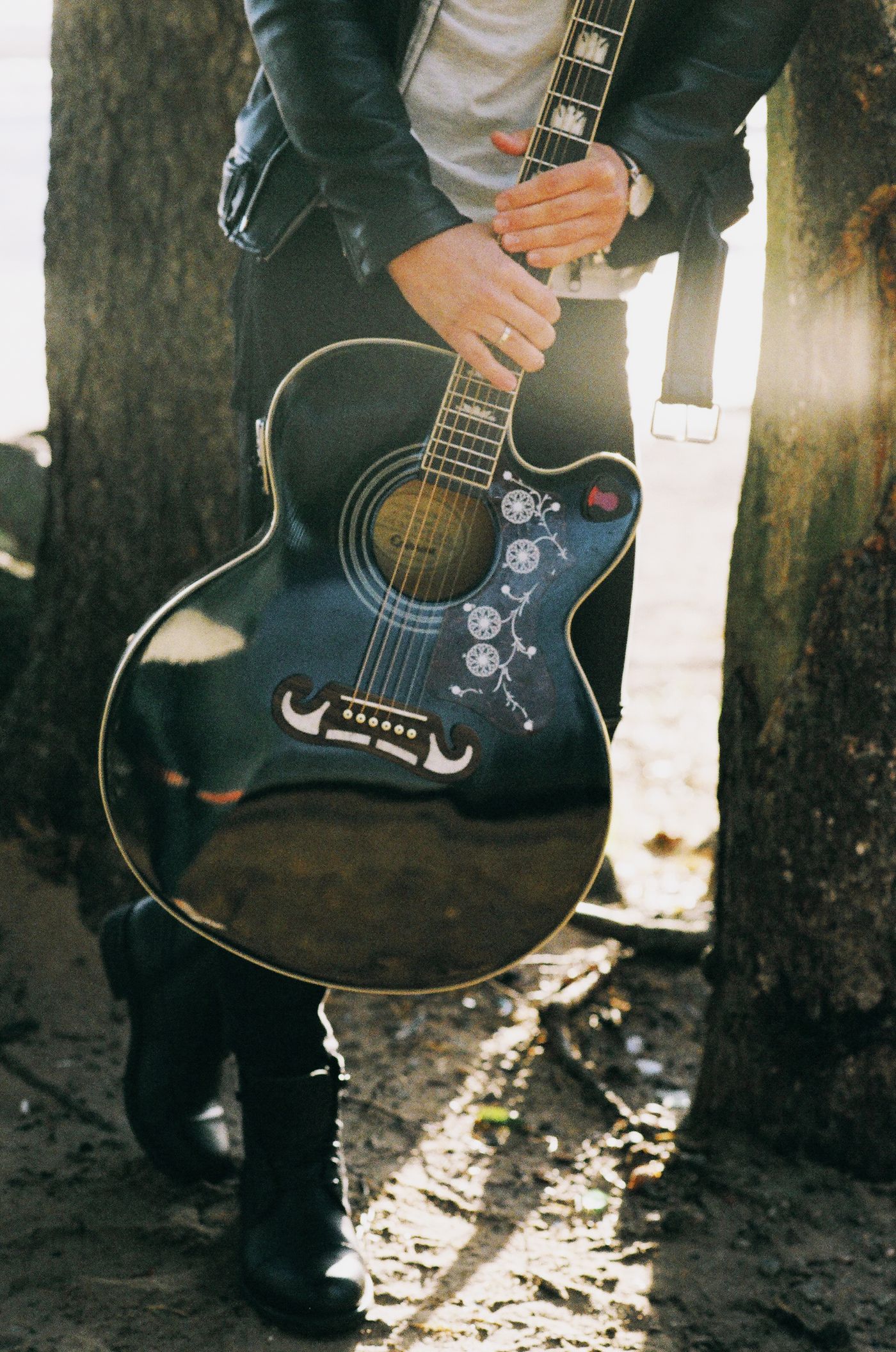 An acoustic guitar with a cutaway body shape