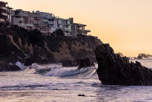 Waves against a rocky shoreline, photo by Trac Vu on Pexels