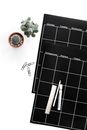 Green Succulent Plant Beside Black Planner