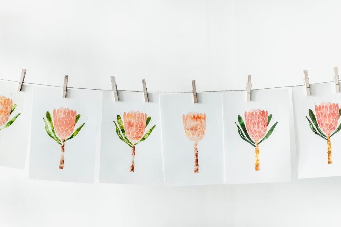 Free White Paper With Orange Flower Print Lot Stock Photo
