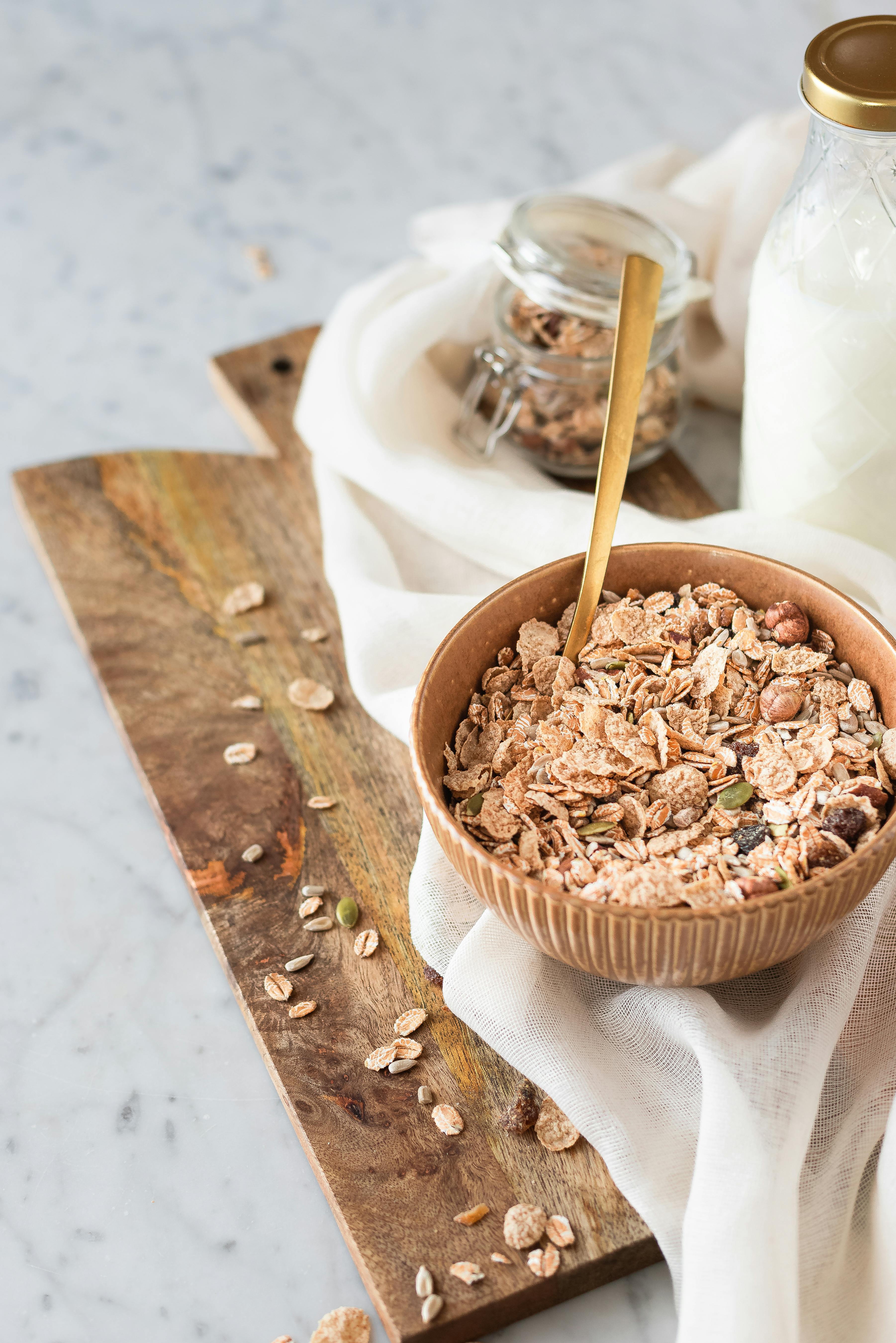 Close-up of granola in a bowl with milk, perfect for a nutritious breakfast.