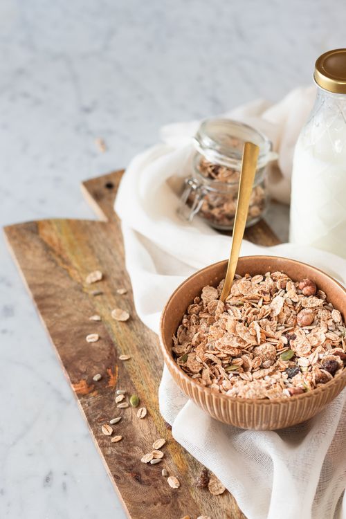 Free Top view of a wholesome breakfast with granola cereal in a bowl and milk. Stock Photo